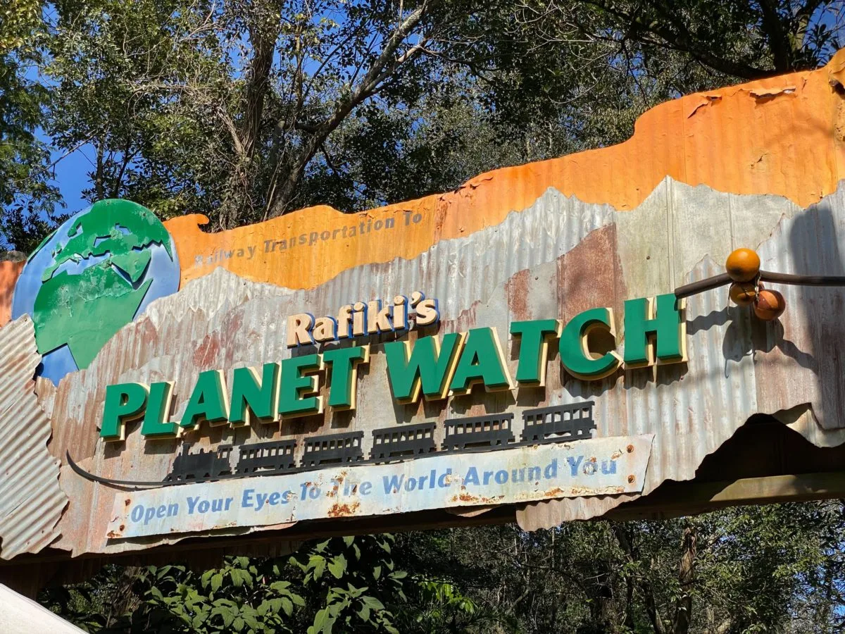 A sign that reads planet watch at Walt Disney World.