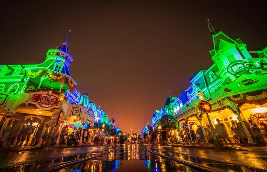 Wet pavement on Main Street at Magic Kingdom during rainy weather