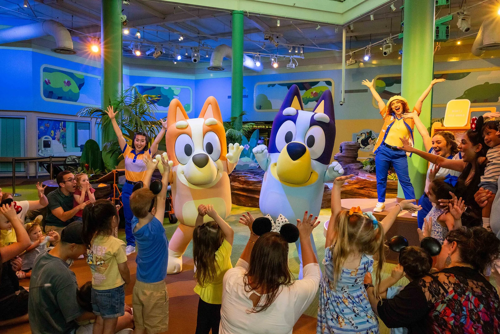 Bluey and Bingo dance with families at Bluey's Wild World at Conservation Station