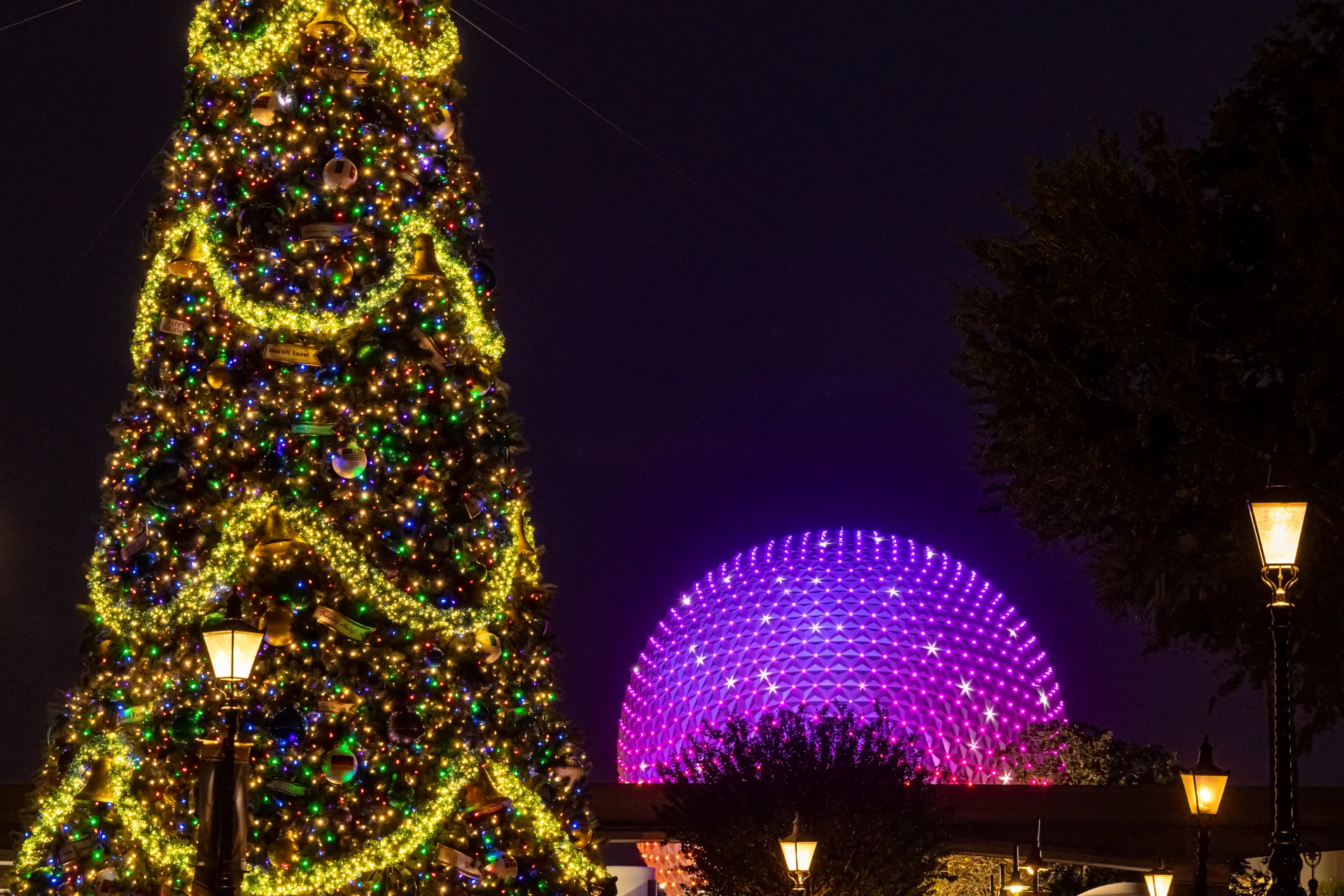 Spaceship Earth and the EPCOT Christmas tree at night