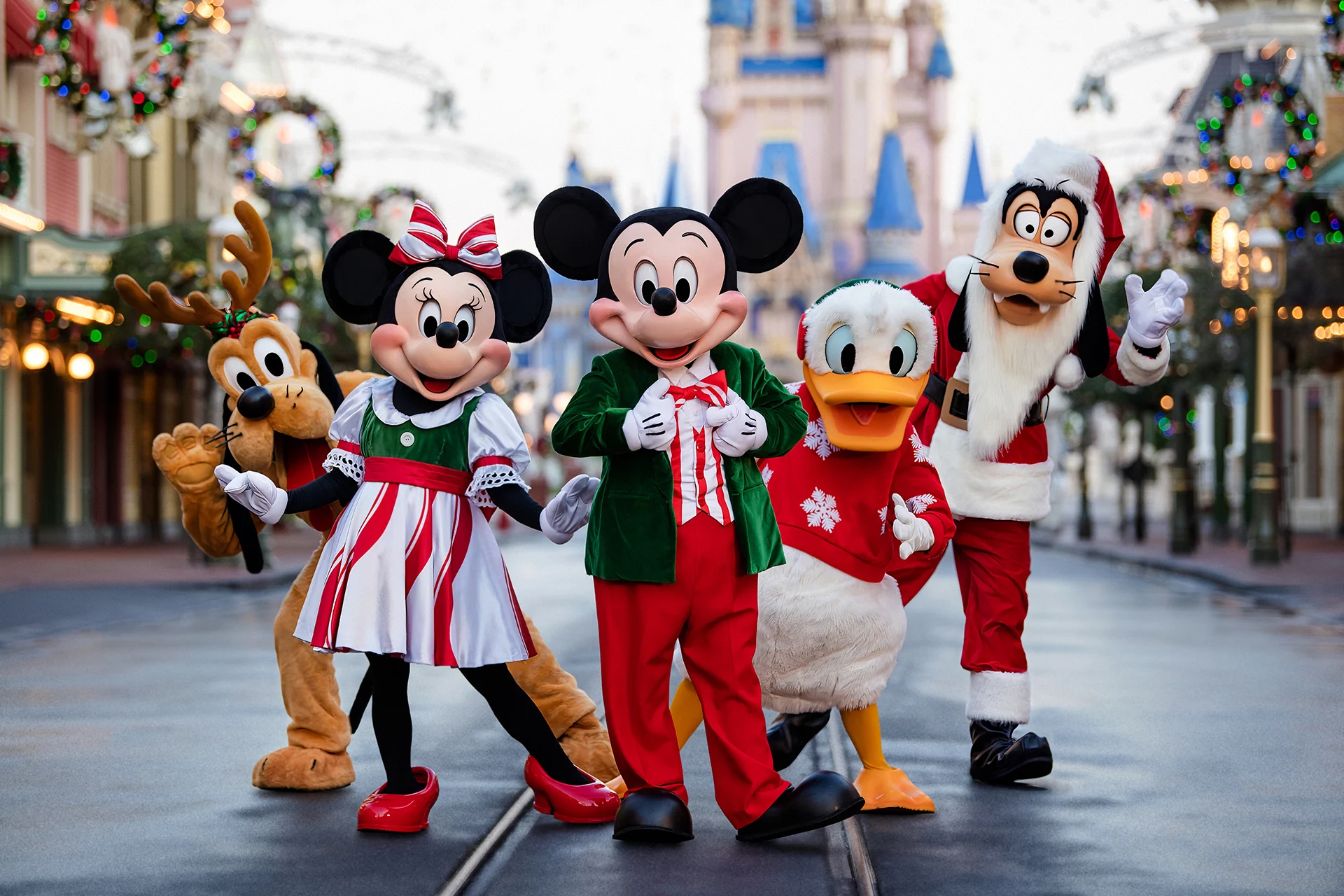 Disney characters wearing holiday costumes at Mickey's Very Merry Christmas Party