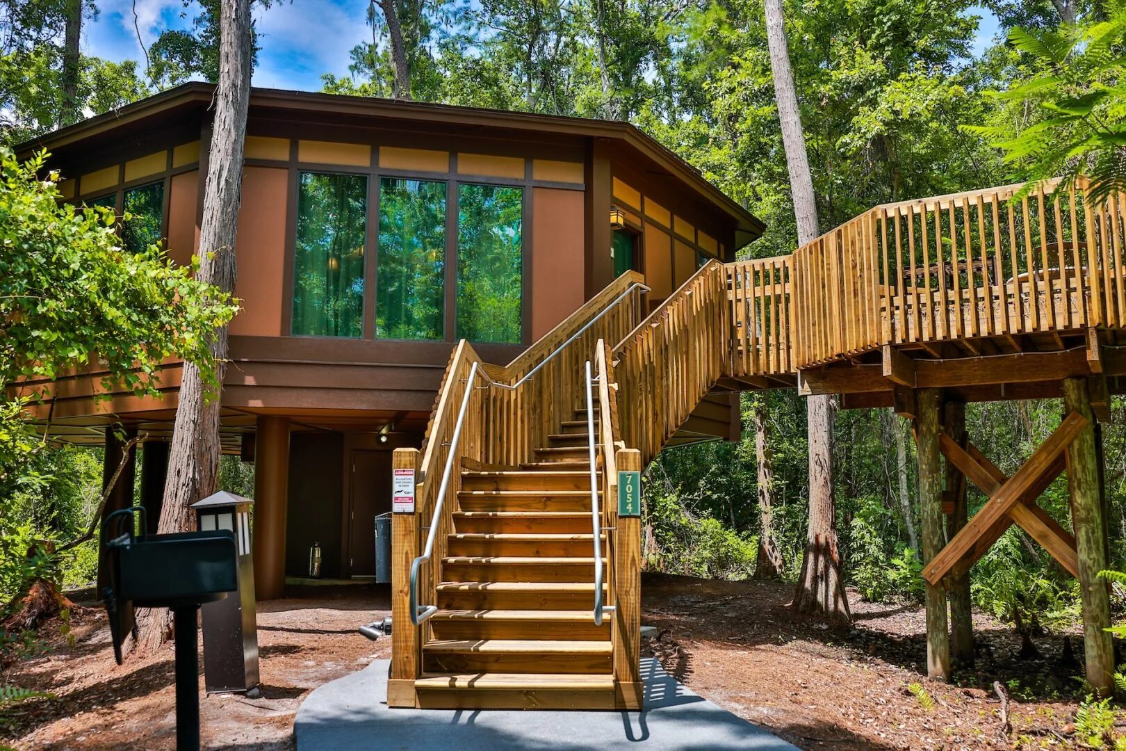 Exterior stairs and elevated deck of a reimagined Treehouse Villa at Disney Saratoga Springs Resort